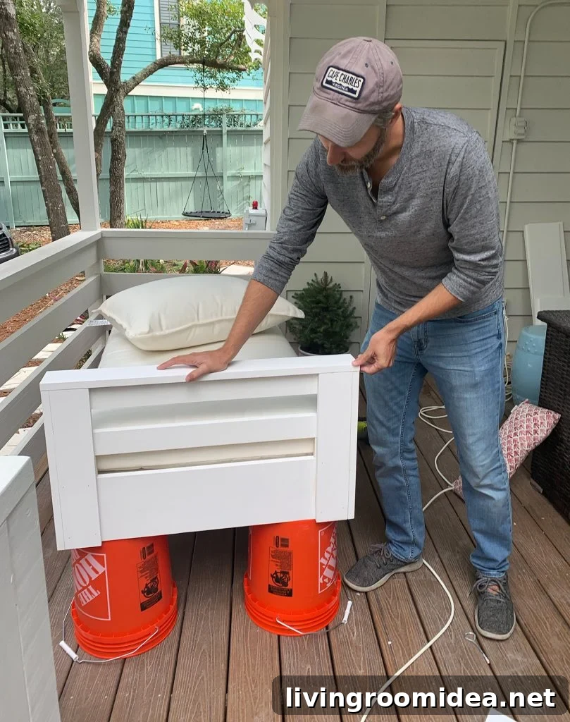 John constructed one side arm on hanging daybed