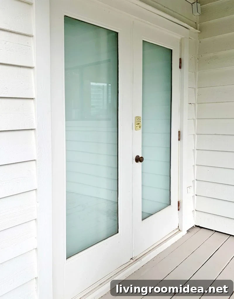 French doors viewed from outside that have been drywalled over