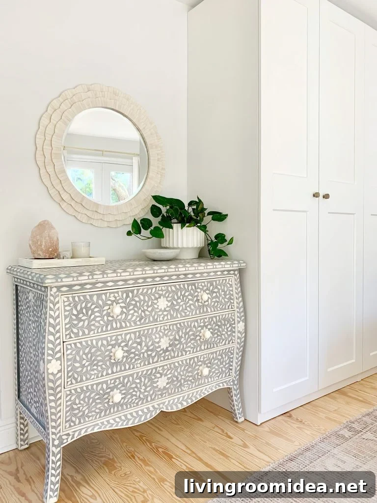 Blue inlay dresser next to Ikea Pax wardrobes with white bone inlay mirror