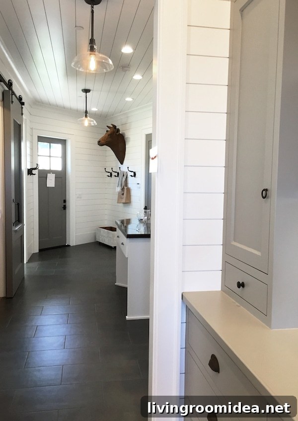 Street of Dreams Mudroom - White Shiplap and Gray Tile Floors