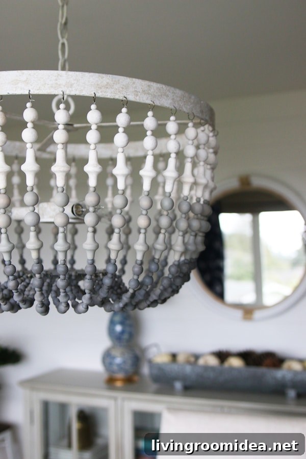Gray Ombre Wood Beaded Chandelier - Click through to see a fall house tour of this small white brick cottage with eclectic coastal farmhouse style. 
