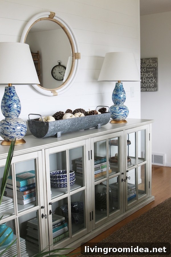 Shiplap Wall - Click through to see a fall house tour of this small white brick cottage with eclectic coastal farmhouse style. 