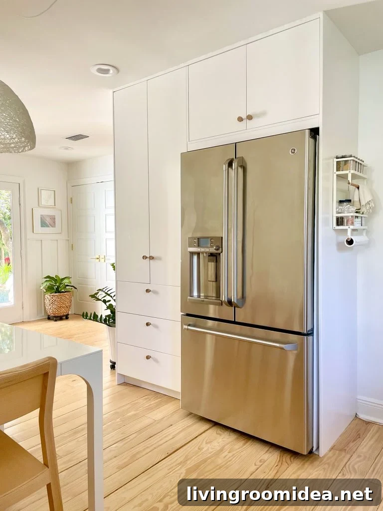 Ikea Built-In Pantry Cabinets Around Stainless Steel Refrigerator